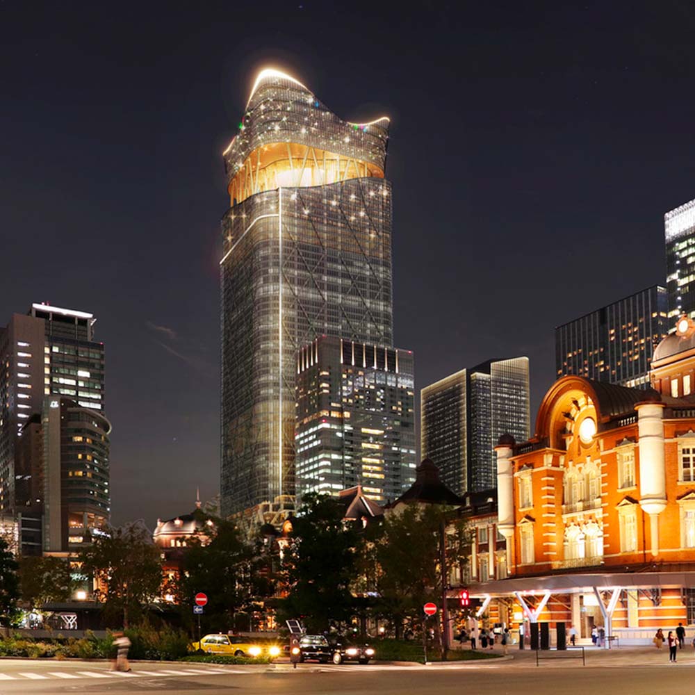 A rendering of Torch Tower from street level, showing the building lit up at night